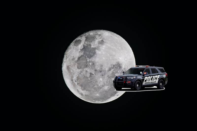 Cop car photoshopped in front of a full moon.
