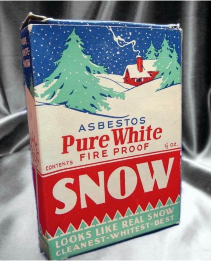 Photograph of vintage box showing an illustration of a cabin at night in a snowy forest with the the words "Asbestos Pure White Fire Proof Snow: Looks Like Real Snow, Cleanest-Whitest-Best"
