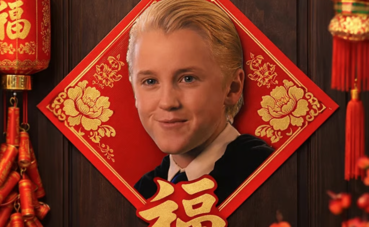 Photograph of young Draco Malfoy from Harry Potter movie franchise on read door decoration with gold Chinese characters.